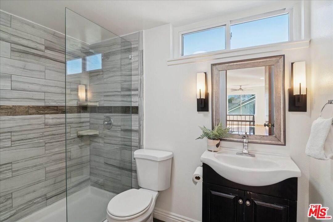 2216 Carlsbad Court Simi Valley, CA 93063 - Photo 25 of 32 a bathroom with a sink toilet and shower
