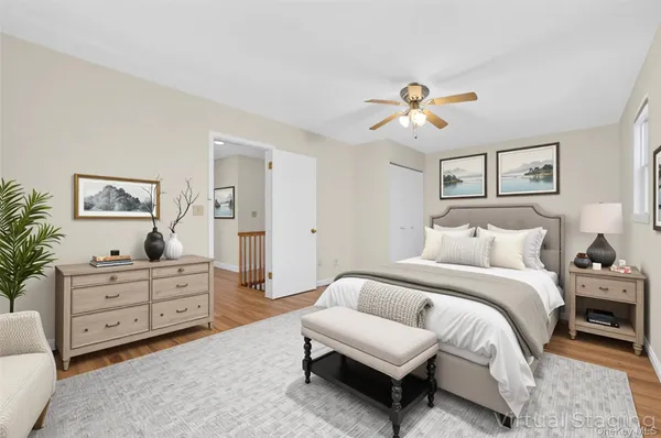 a spacious bedroom with a bed and a couch