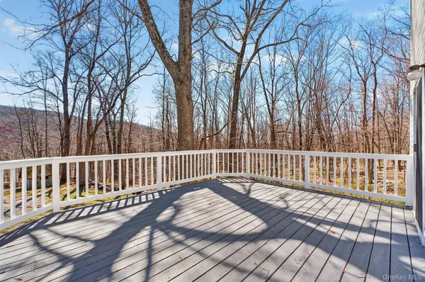 a view of deck with wooden floor and fence