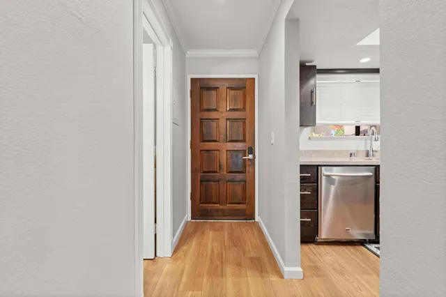 a view of a kitchen from the hallway