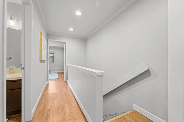 a view of a hallway with a white walls