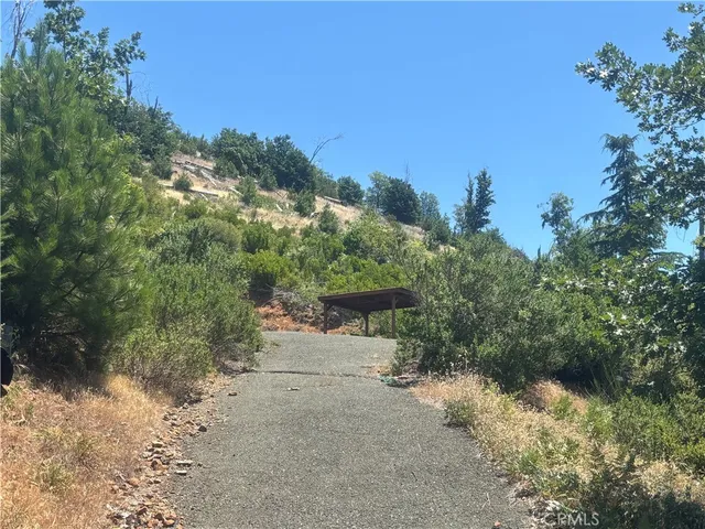 a view of a road with trees in the background