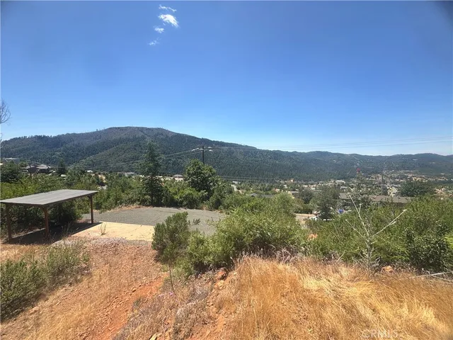 a view of a town with mountains in the background