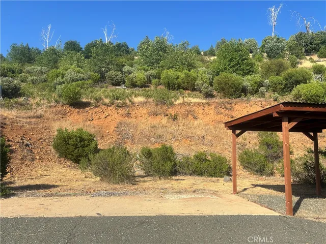 a view of wooden fence and a yard