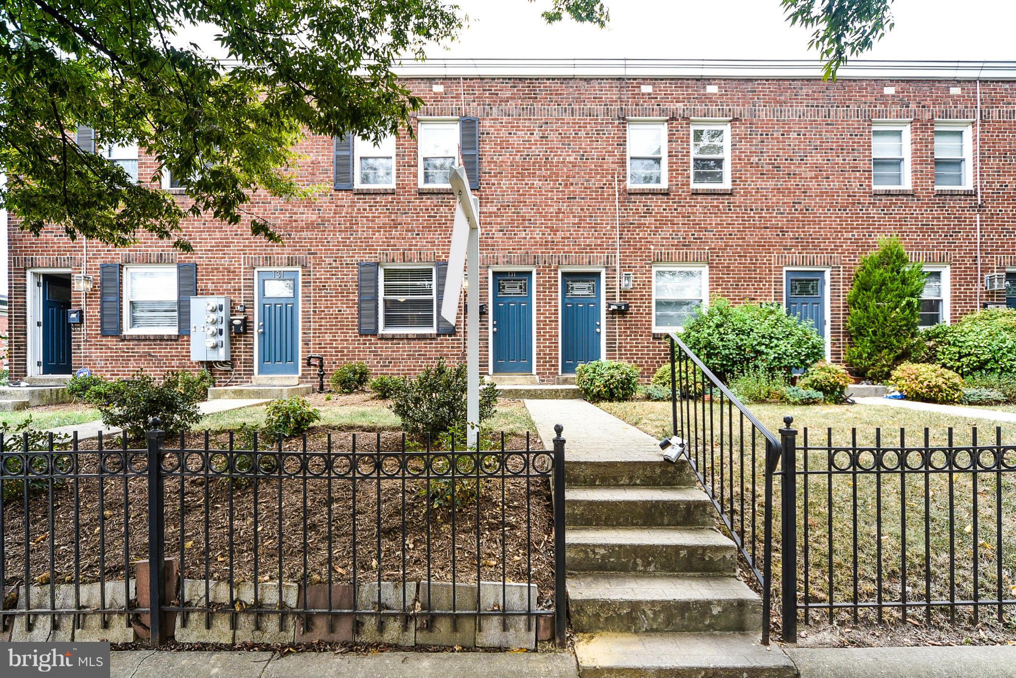 131 17th Street Southeast, Unit 2 Washington, DC 20003 - Photo 1 of 15 a front view of a house with a garden