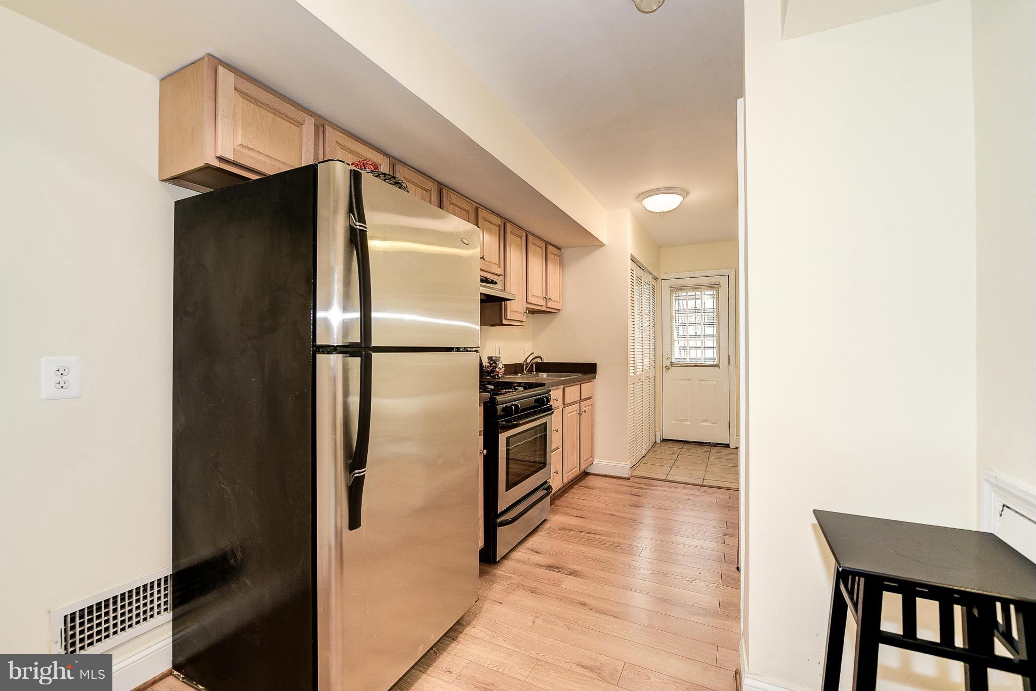 131 17th Street Southeast, Unit 2 Washington, DC 20003 - Photo 7 of 15 a kitchen with stainless steel appliances a refrigerator and a stove