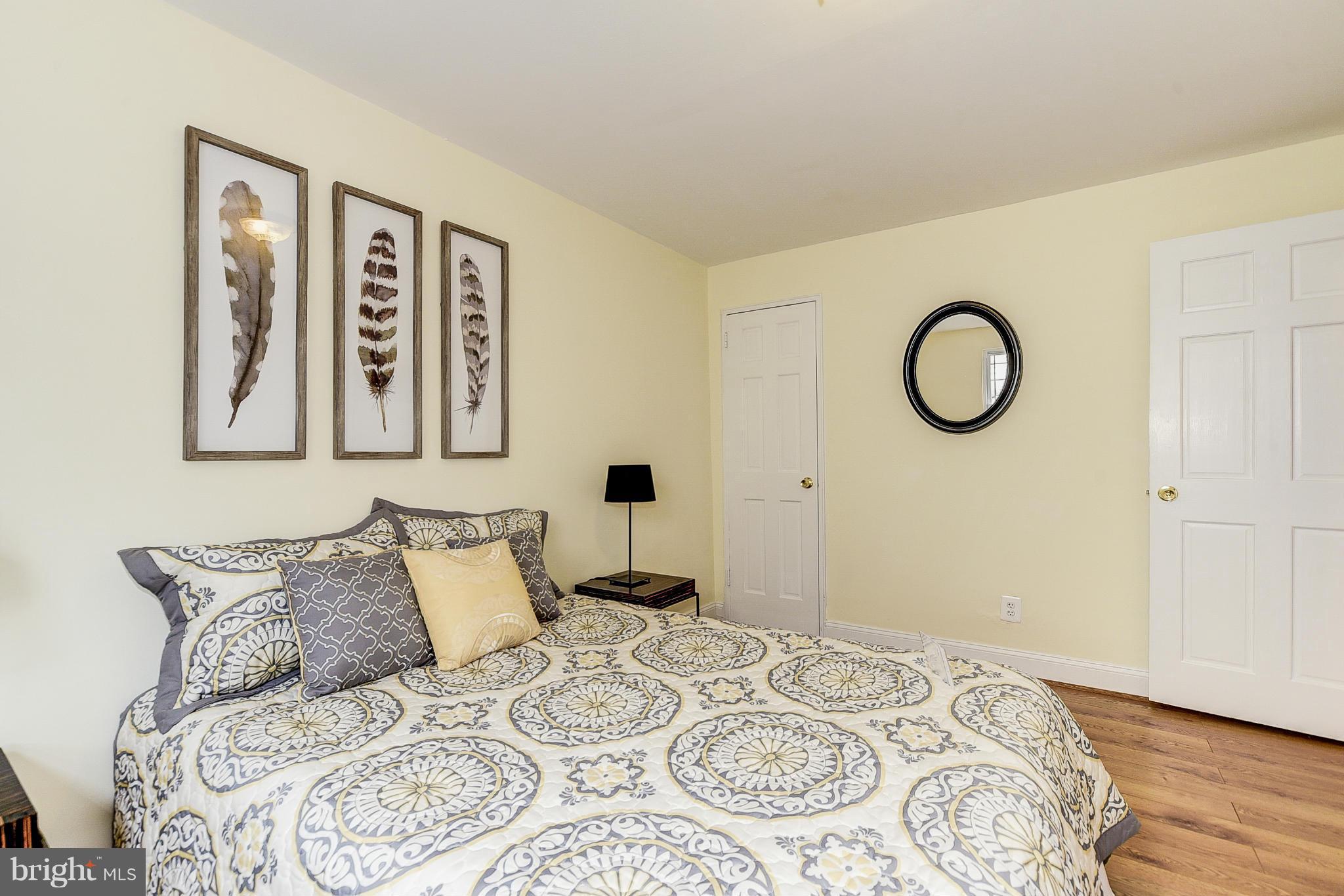 131 17th Street Southeast, Unit 2 Washington, DC 20003 - Photo 10 of 15 a bedroom with a large bed and a window