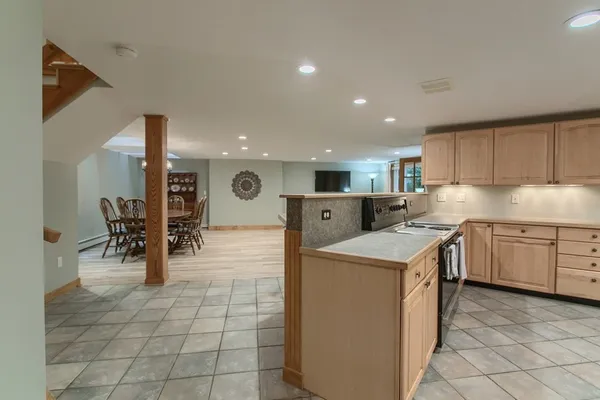 a kitchen with a sink a counter top space and appliances