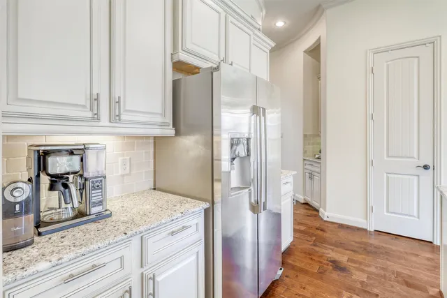 a kitchen with granite countertop a sink and a granite top