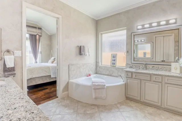 a view of a hallway with wooden floor windows and a livingroom
