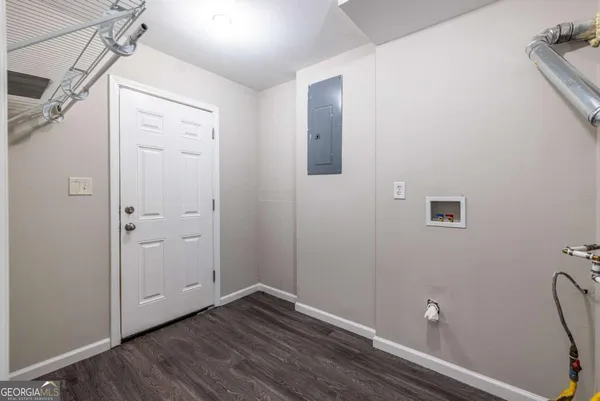 a view of a small space with wooden floor