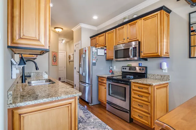 a view of balcony with wooden floor and seating space