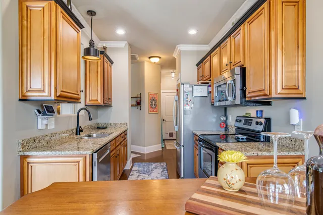 an aerial view of residential houses with yard