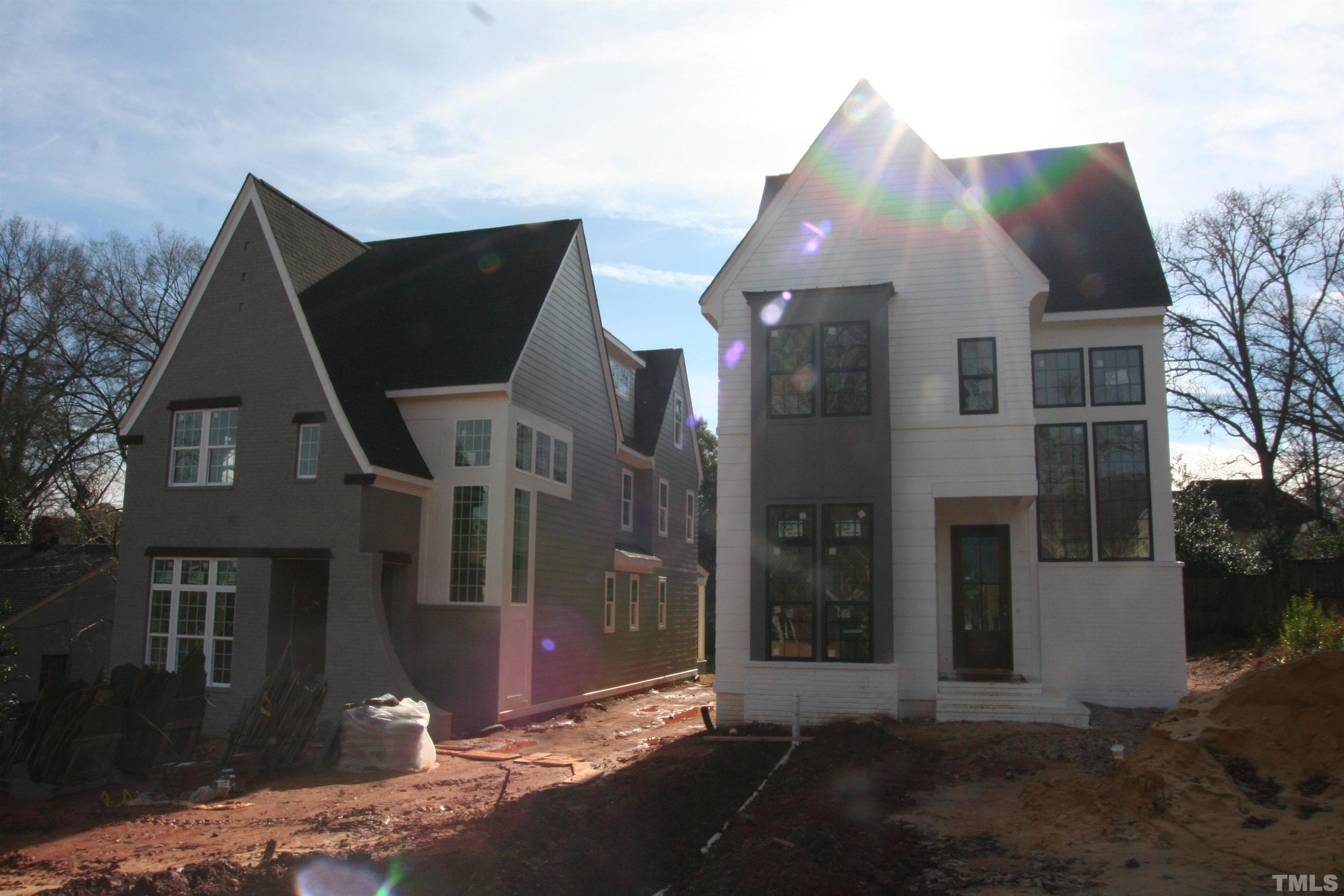 3027 Farrior Road Raleigh, NC 27607 - Photo 1 of 18 a view of a brick house with many windows next to road