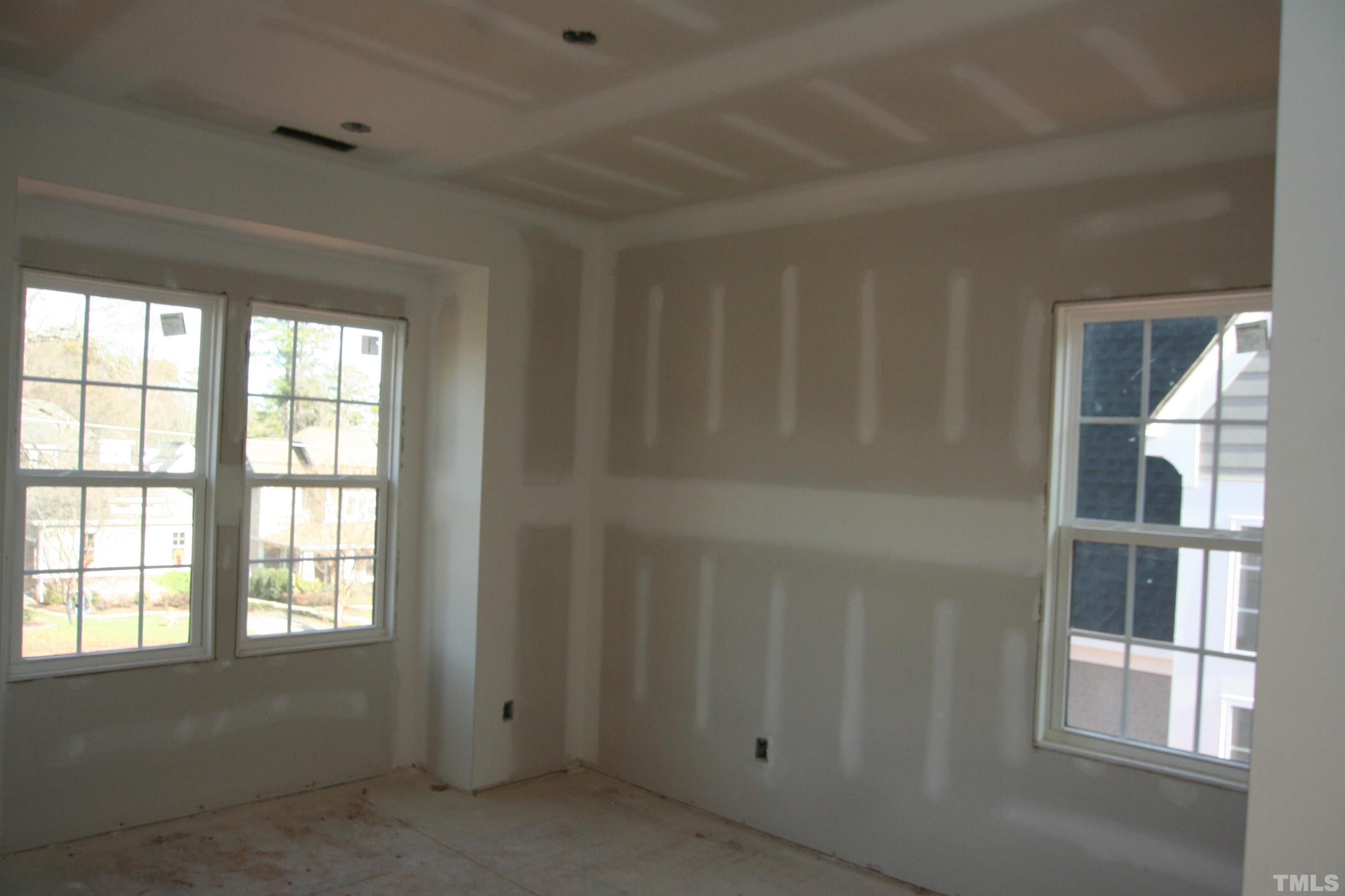 3027 Farrior Road Raleigh, NC 27607 - Photo 11 of 18 an empty room with windows