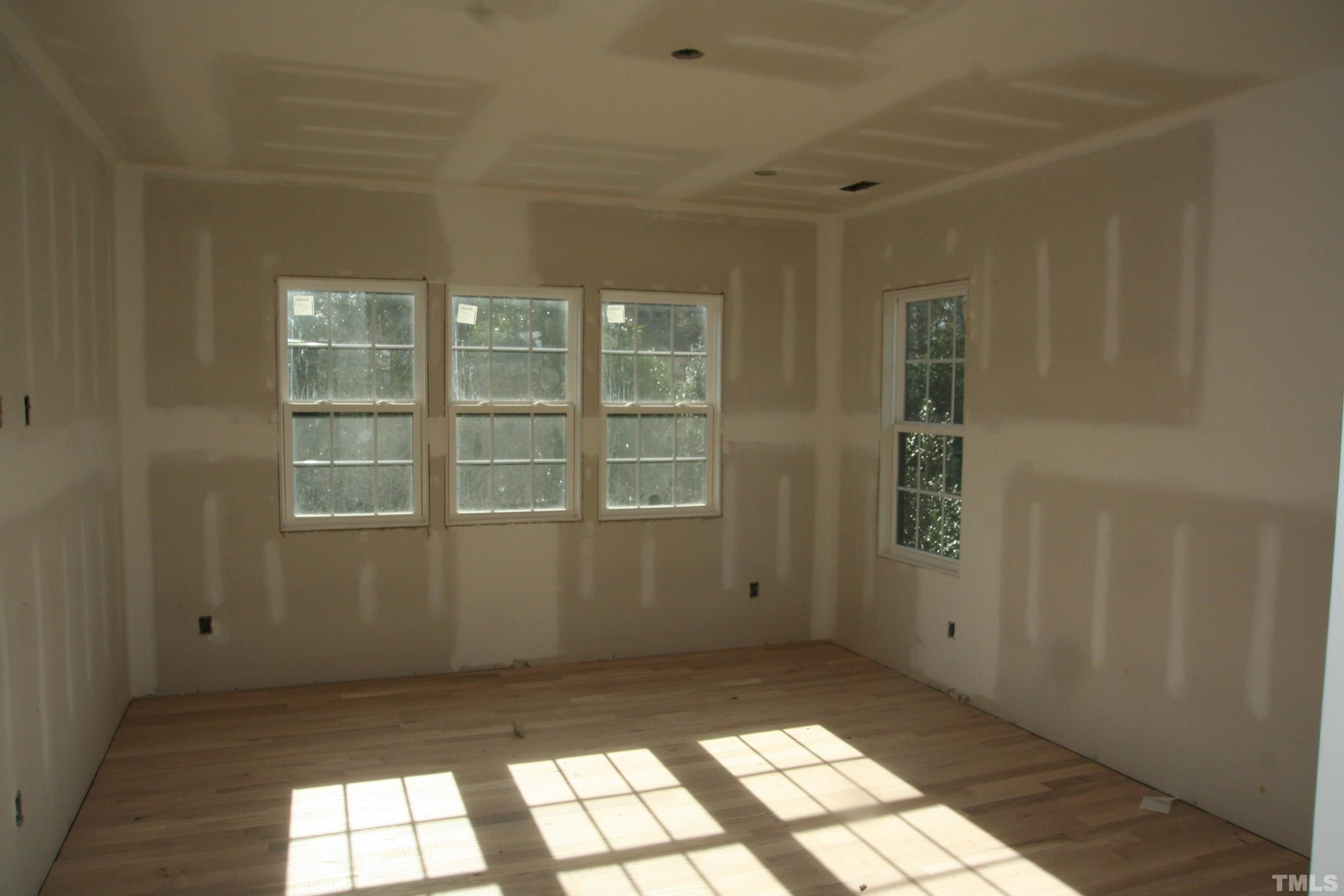 3027 Farrior Road Raleigh, NC 27607 - Photo 12 of 18 a view of an empty room with a window