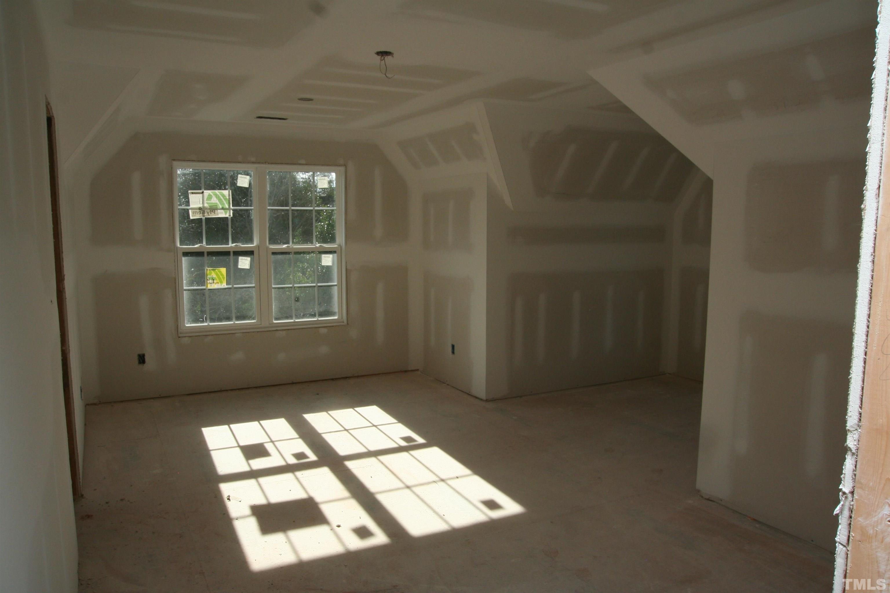 3027 Farrior Road Raleigh, NC 27607 - Photo 16 of 18 an empty room with windows