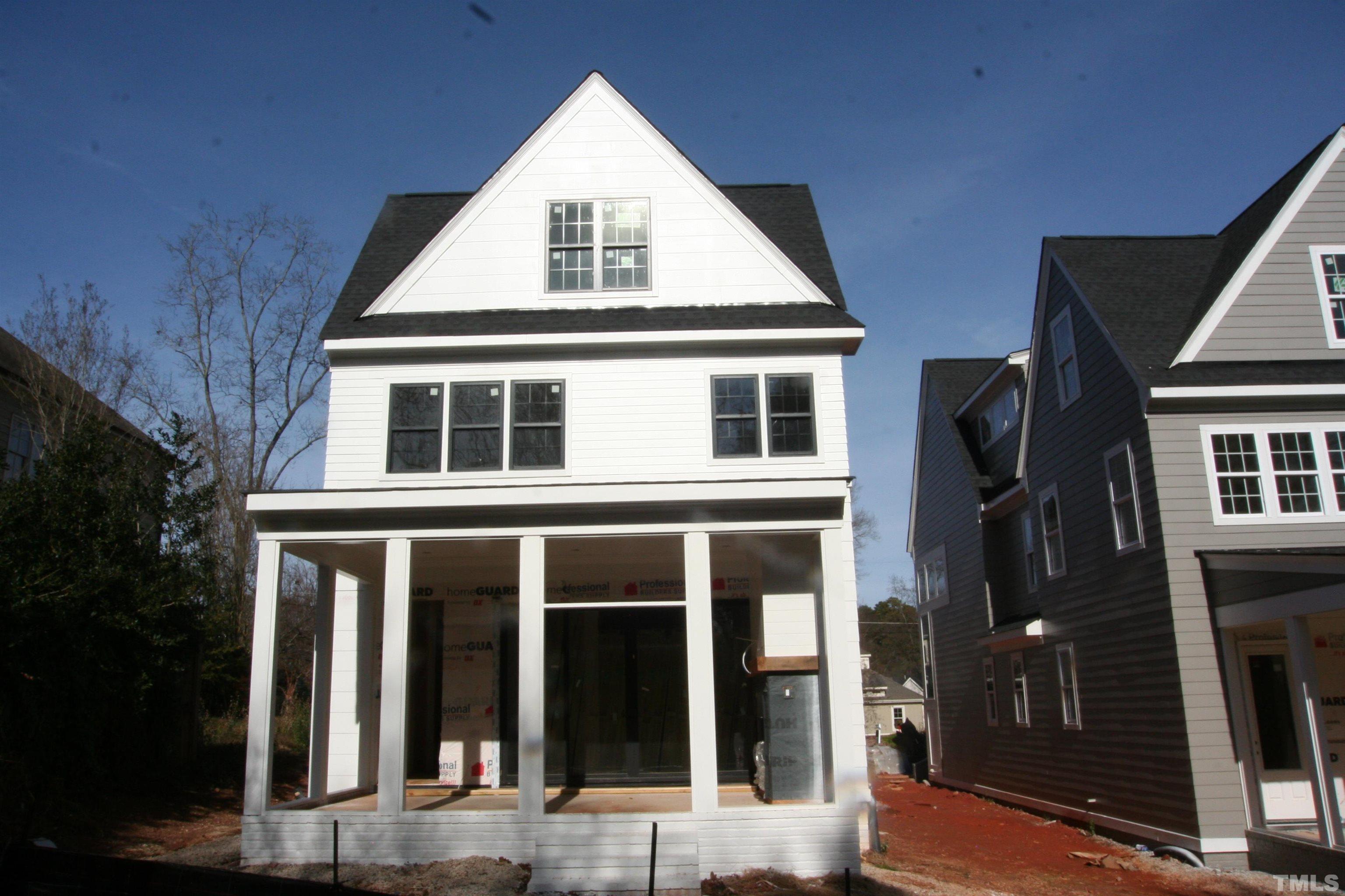 3027 Farrior Road Raleigh, NC 27607 - Photo 8 of 18 a view of a brick house with large windows