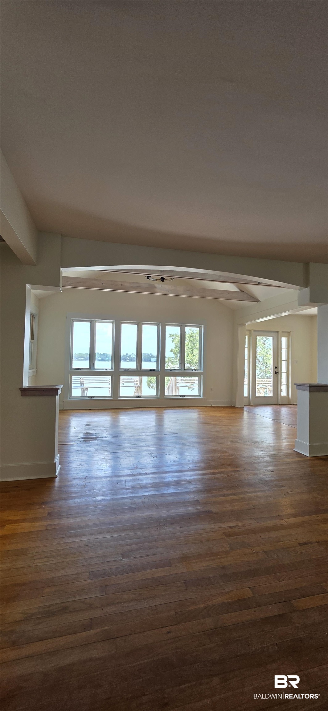 544 Windmill Ridge Road Gulf Shores, AL 36542 - Photo 20 of 50 Unfurnished living room featuring wood finished floors