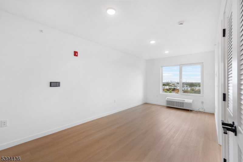 768 Bergen Street, Unit 5D Newark, NJ 07108 - Photo 11 of 14 a view of an empty room with a window