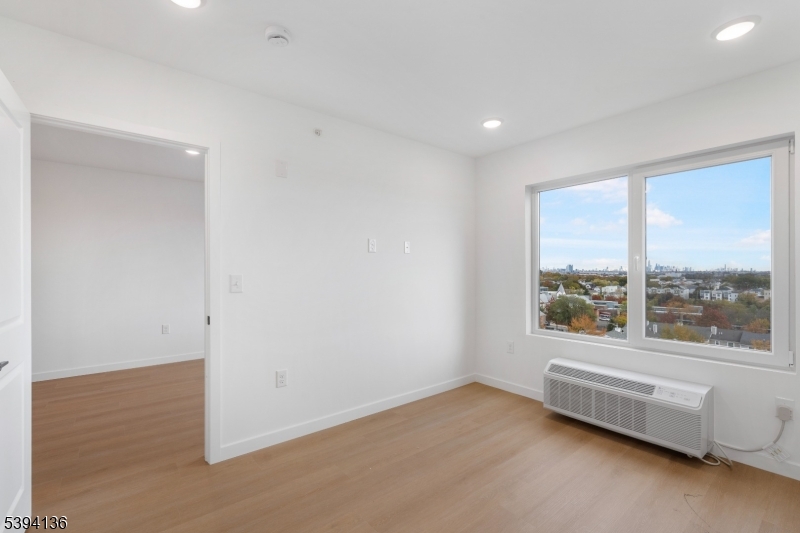 768 Bergen Street, Unit 5D Newark, NJ 07108 - Photo 6 of 14 a view of an empty room with a window