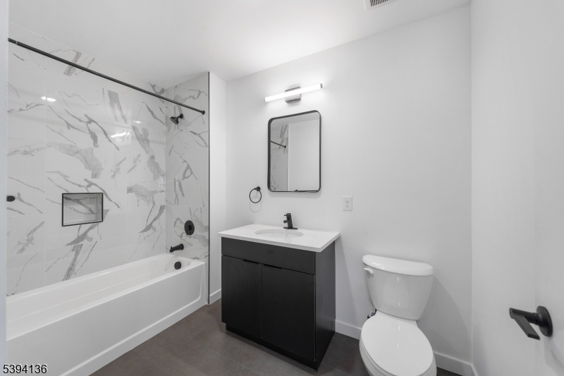 768 Bergen Street, Unit 5D Newark, NJ 07108 - Photo 8 of 14 a bathroom with a sink toilet and shower