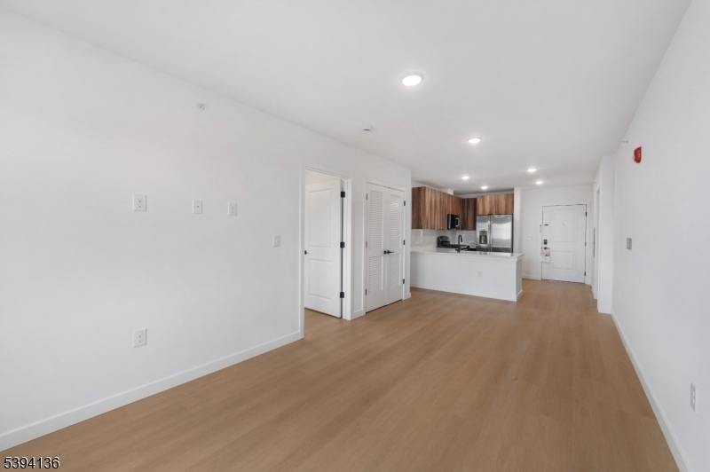 768 Bergen Street, Unit 5D Newark, NJ 07108 - Photo 10 of 14 a view of a kitchen with a sink and a refrigerator