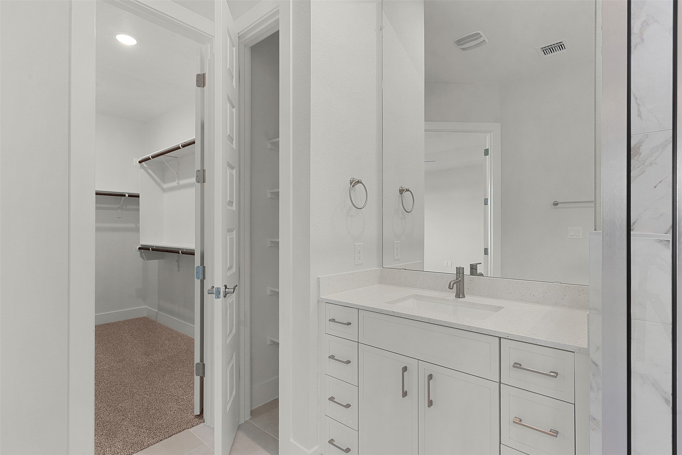 1129 Pansy Trail Georgetown, TX 78628 - Photo 19 of 29 Bathroom vanity featuring a white quartz countertop, undermount sink, and brushed nickel faucet