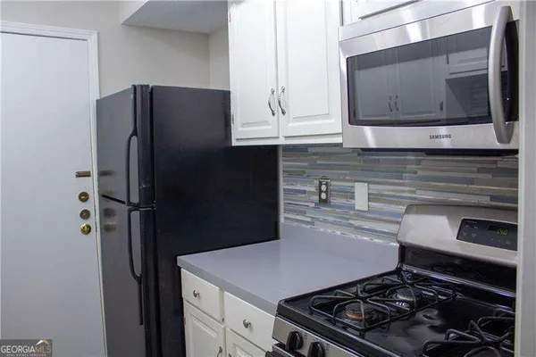 a kitchen with a sink and a window