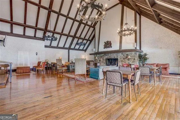 a view of a dining room with furniture window and wooden floor