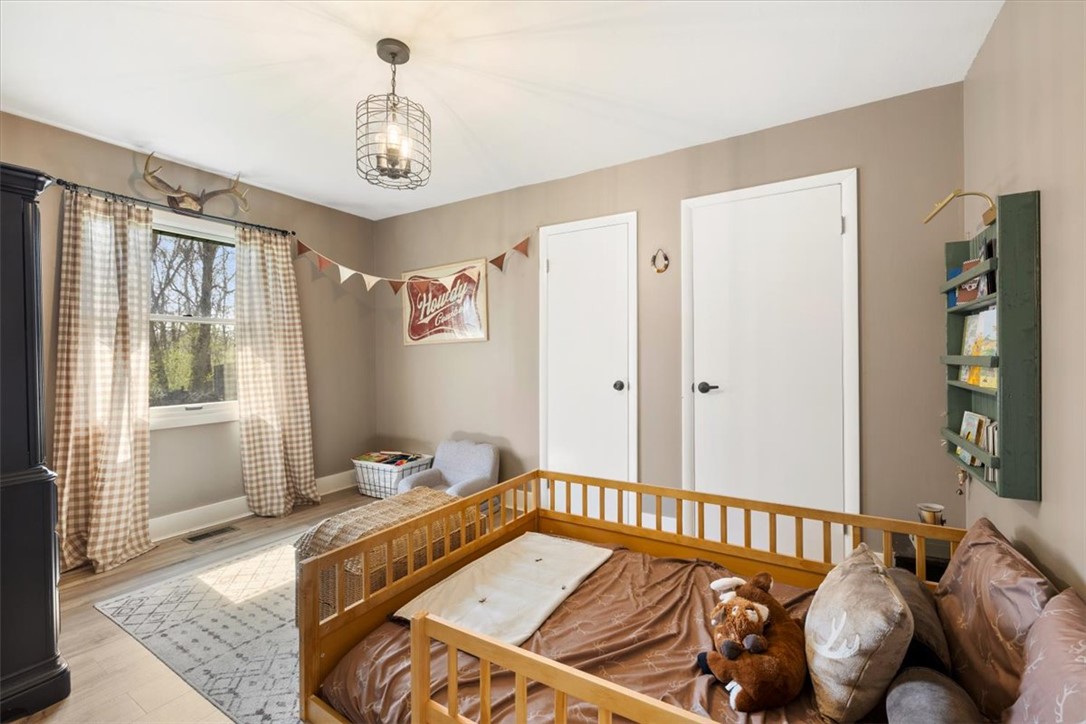 9555 Clyo Road Dayton, OH 45458 - Photo 19 of 31 This cozy bedroom features warm tones, inviting natural light, and ample space for rest and play.