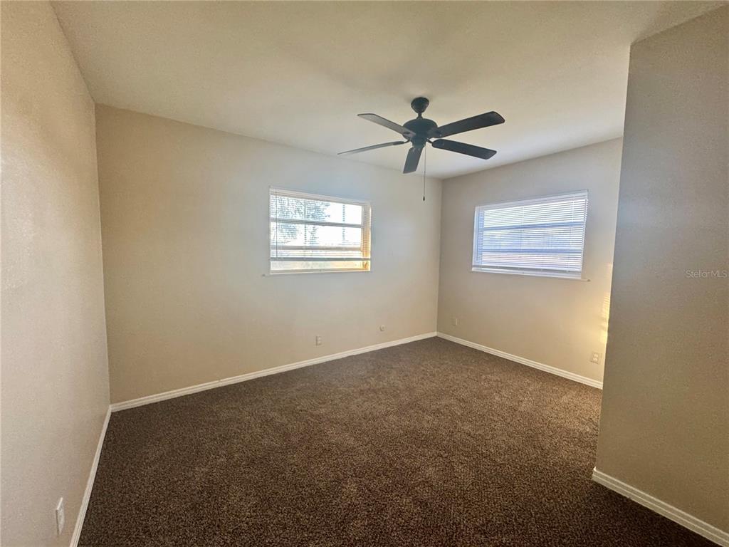 1516 Hawk Griffin Road Plant City, FL 33563 - Photo 15 of 17 a view of room with window and ceiling fan