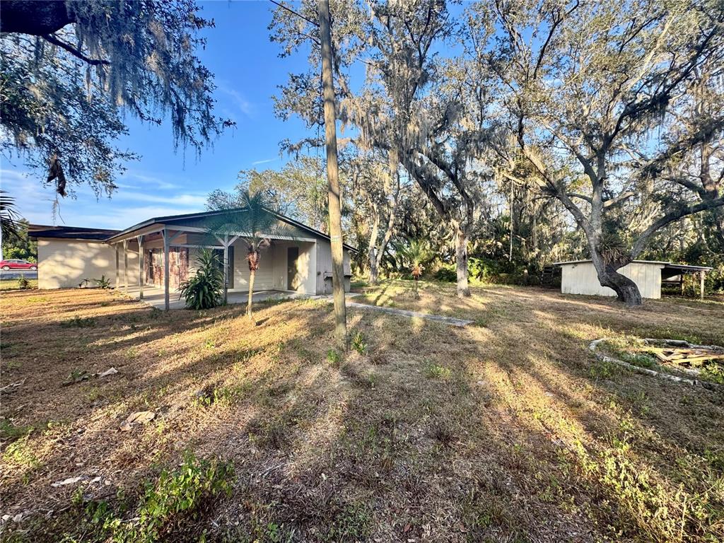 1516 Hawk Griffin Road Plant City, FL 33563 - Photo 6 of 17 a view of a house with a yard