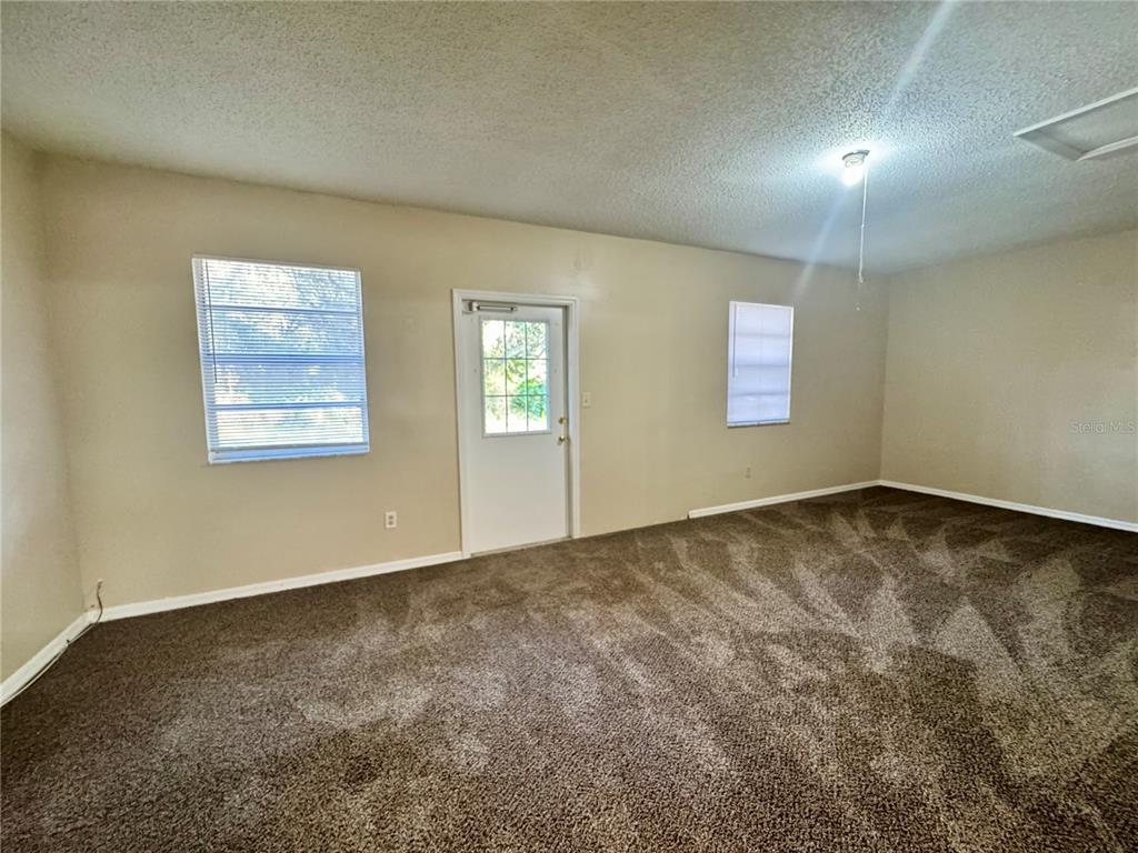 1516 Hawk Griffin Road Plant City, FL 33563 - Photo 8 of 17 an empty room with a window