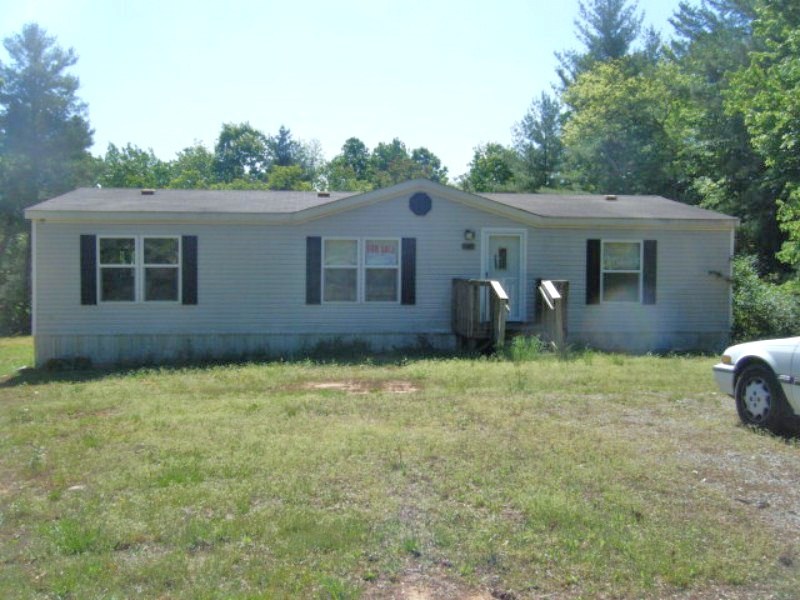 203 Creek Valley Road Stuart, VA 24171 - Photo 1 of 6 front view of a house with a yard