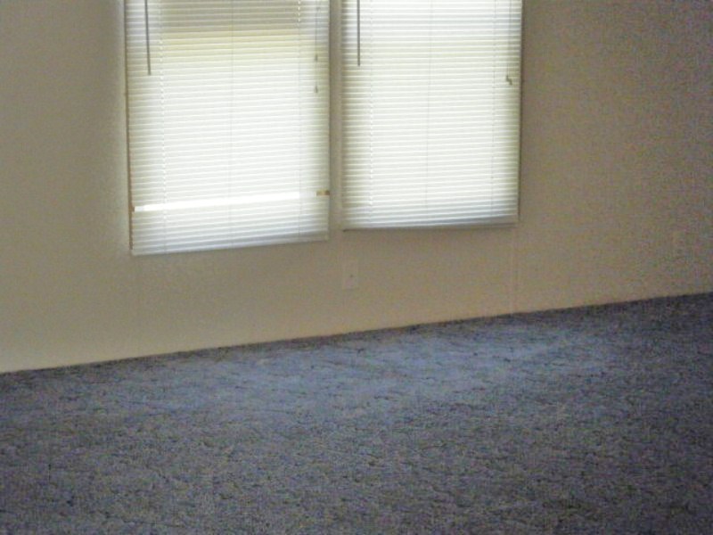 203 Creek Valley Road Stuart, VA 24171 - Photo 3 of 6 an empty room with a window