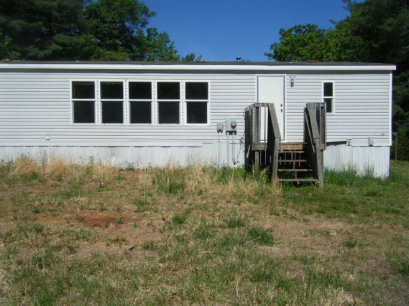 203 Creek Valley Road Stuart, VA 24171 - Photo 4 of 6 a house view with a backyard space