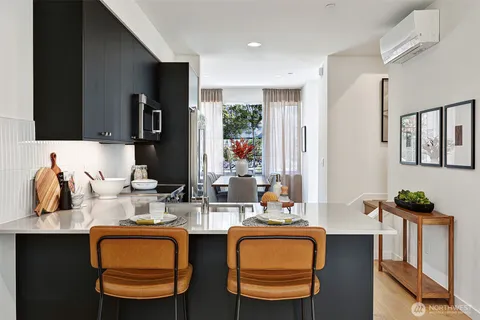 a dining room with furniture and window
