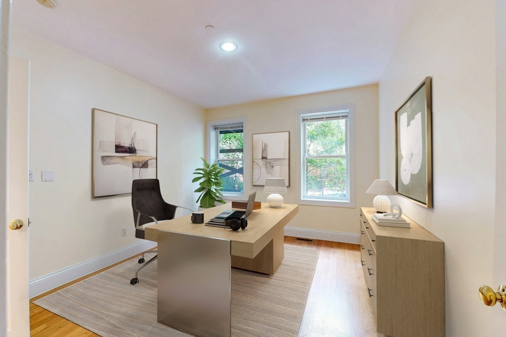 460 Massachusetts Avenue, Unit B Boston, MA 02118 - Photo 14 of 23 a living room with furniture and wooden floor