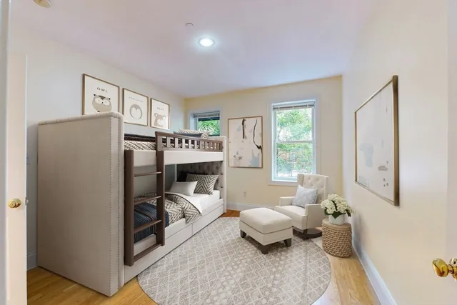 a living room with furniture a window and a table