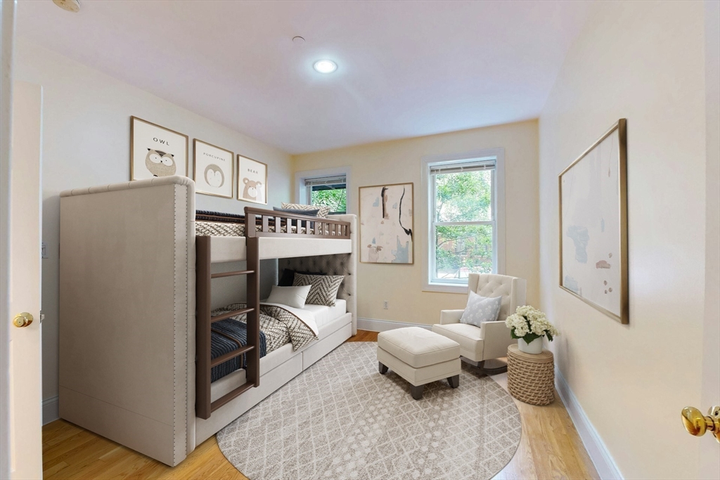 460 Massachusetts Avenue, Unit B Boston, MA 02118 - Photo 15 of 23 a living room with furniture a window and a table