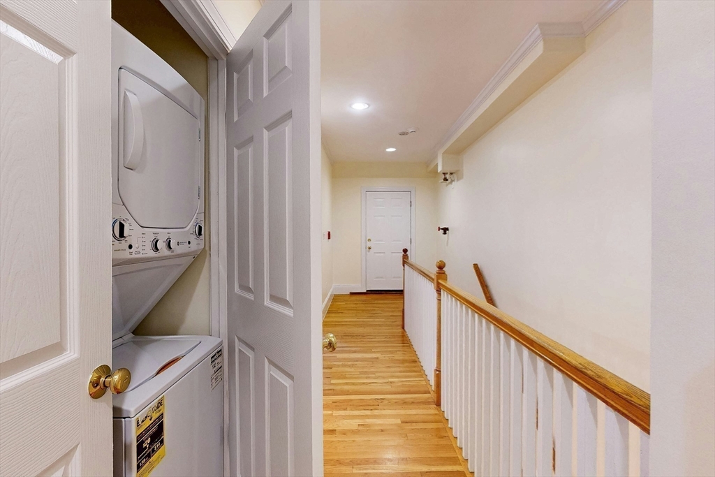 460 Massachusetts Avenue, Unit B Boston, MA 02118 - Photo 16 of 23 a view of a hallway with wooden floor and staircase