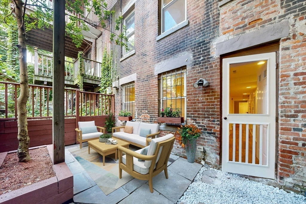 460 Massachusetts Avenue, Unit B Boston, MA 02118 - Photo 20 of 23 a building outdoor space with patio furniture