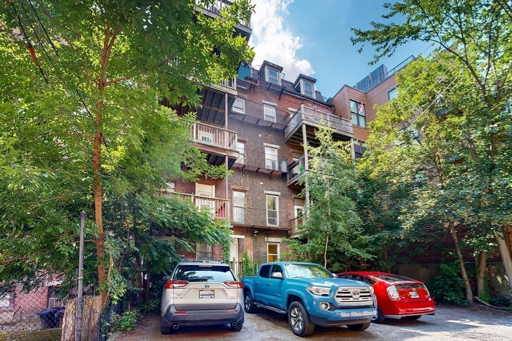 460 Massachusetts Avenue, Unit B Boston, MA 02118 - Photo 21 of 23 a car parked in front of a building