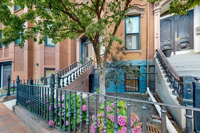 front view of a house with a small yard