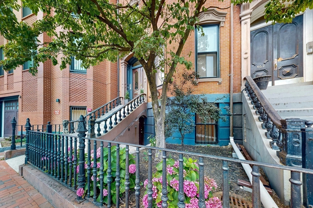 460 Massachusetts Avenue, Unit B Boston, MA 02118 - Photo 22 of 23 front view of a house with a small yard