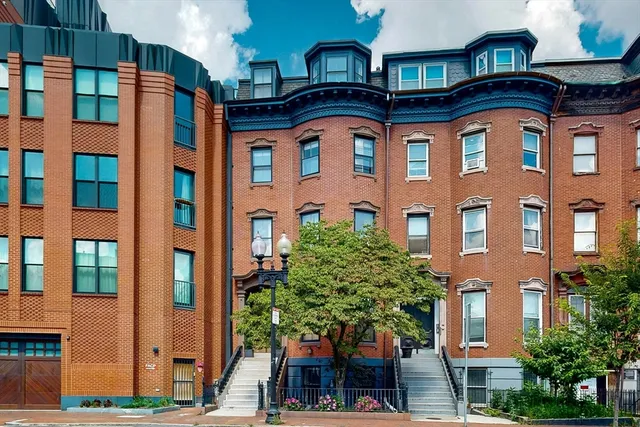 a front view of a multi story residential apartment building