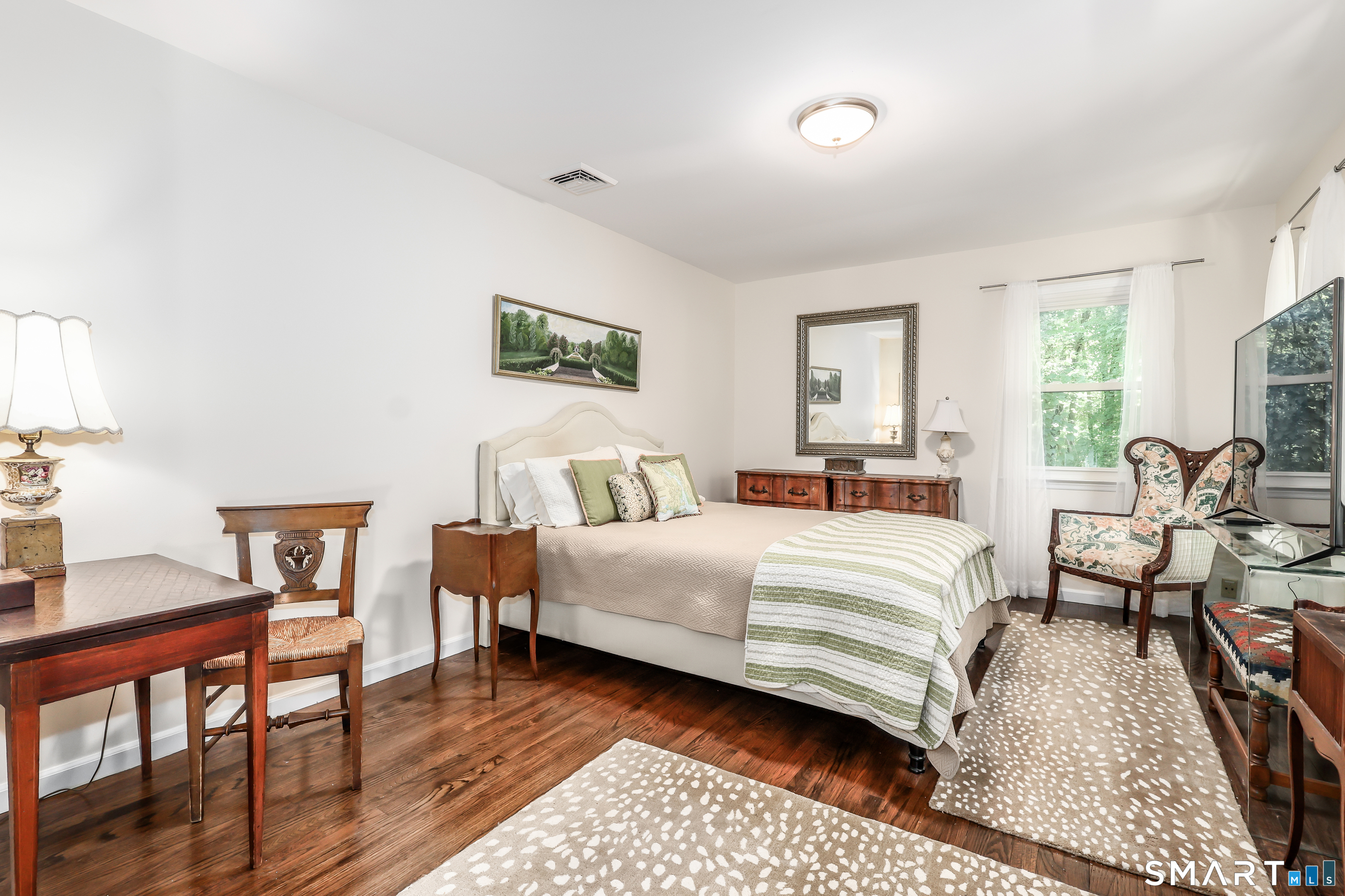 23 Old Green Road Newtown, CT 06482 - Photo 23 of 36 a bedroom with a bed and wooden floor