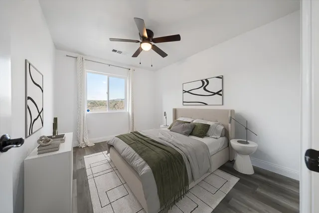 a bedroom with a bed and window