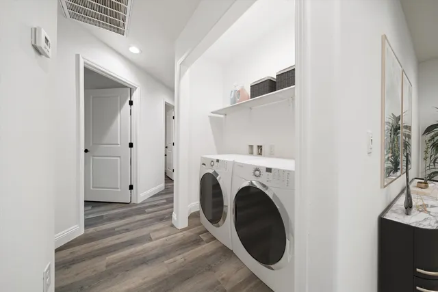 a view of a storage & utility room with washer and dryer